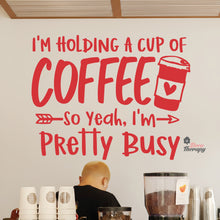 Load image into Gallery viewer, I'm Holding A Cup Of Coffee So I'm Pretty Busy Wall Decal